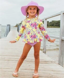 RuffleButts Daisy Delight Long Sleeve Rashguard Bikini -Baby Go Round Store rgslmxx ddls rufflebutts yellow purple floral long sleeve rash guard bikini girls swimsuit