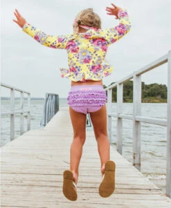 RuffleButts Daisy Delight Long Sleeve Rashguard Bikini -Baby Go Round Store rgslmxx ddls rufflebutts yellow purple floral long sleeve rash guard bikini girls swimsuit2
